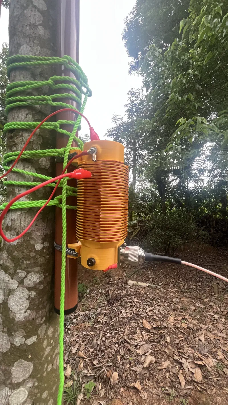 Figure 2: 3D printed vertical coil by SA2CLC with the Gigaparts POTA20 anchored to a dried/chopped tree stump.